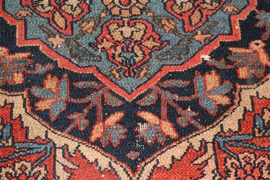 A Persian red ground rug 194 x 137cm